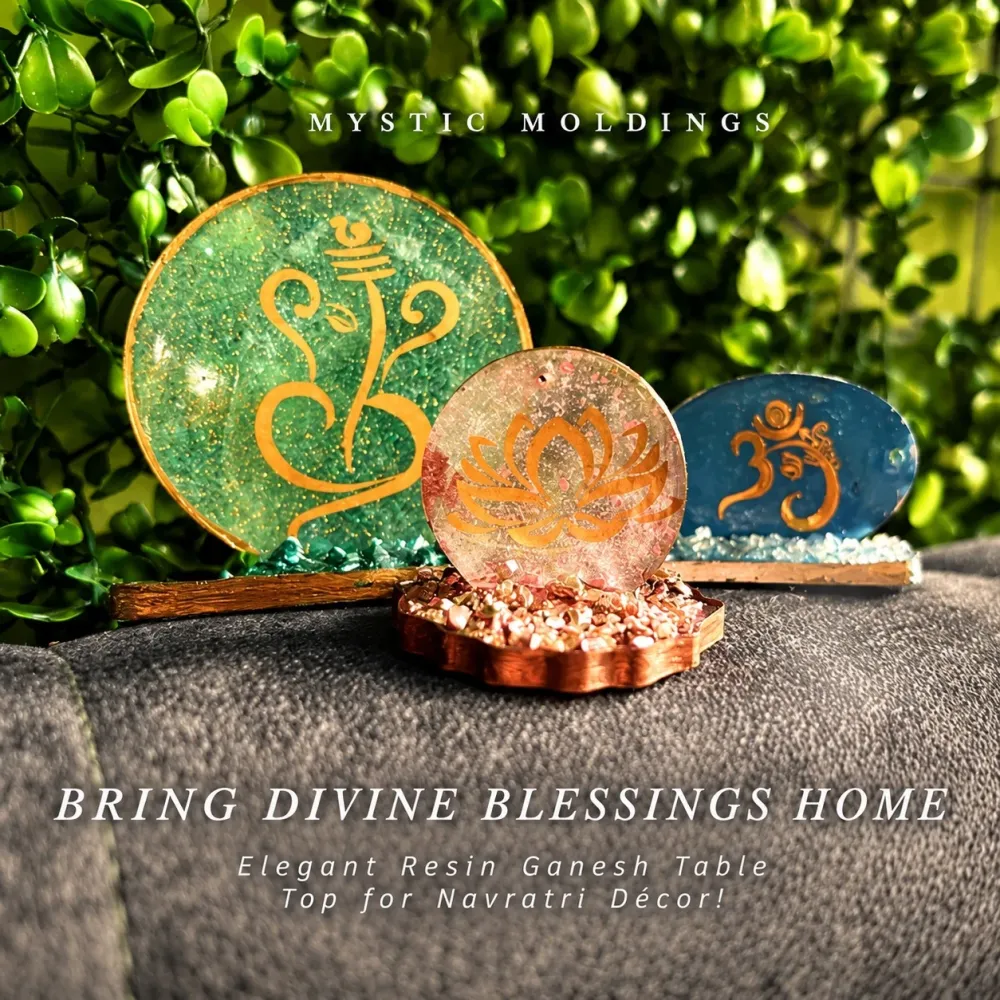 Three resin table tops with gold Ganesh, lotus and Om motifs on crushed-stone bases, with the words Bring divine blessings home